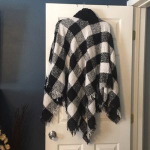 Size medium poncho top. Never worn
